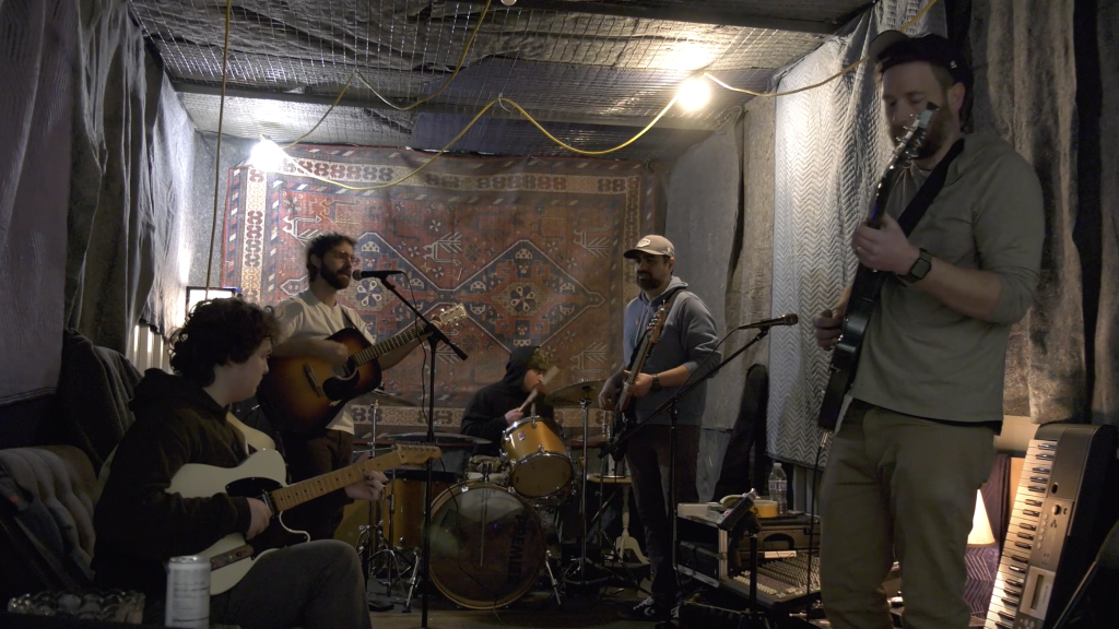 5 piece rock band in a small practice space